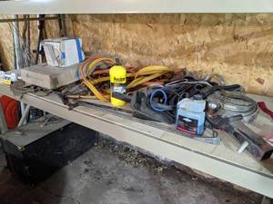 Garage Items on Shelf - Straps, Jumper Cables, Brake Fluid, Ceramic Tile and More