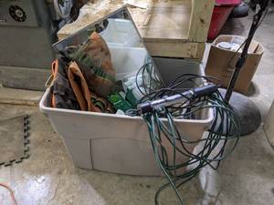 Extension Cord, Trouble Light and Tote full of Garage Misc.