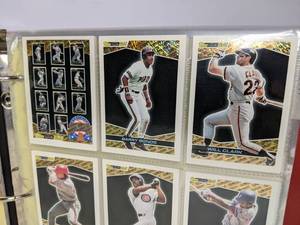 lot 75 image: Baseball and Football Card Binder Collection Kirby Puckett Michael Irvin Bonds