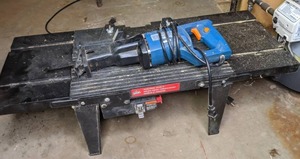 lot 224 image: Chicago Electronic Reciprocating Saw & Vermont America Router Table