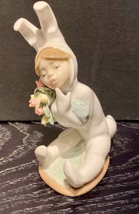 lot 31 image: Lladro Figurine of a Child in a Bunny Costume