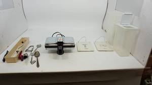Three Sterilite Storage Containers--Two Ceramic Rectangle Decorative Hanging Items--Prego Pizzelle Baker--Container Of Misc. Items