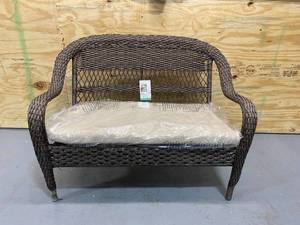 lot 22 image: STYLEWELL Stackable Woven Loveseat (with bonus pillows)