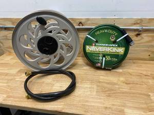lot 102 image: TEKNOR APEX Neverkink 58 in. x 50 ft. Heavy Duty Garden Hose with SUNCAST 125 ft. Side Tracker Wall Mount Hose Reel