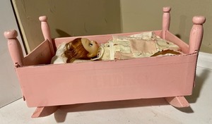 Cradle Made of a Cigar Box and Small Doll