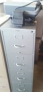 4 Drawer File Cabinet and Projector.