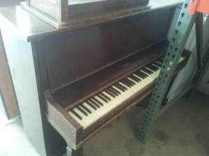 HOWARD upright Piano with bench and mover.