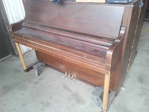 EVERETT Piano with mover dolly.