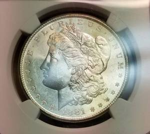 lot 18 image: 1881-S MORGAN SILVER DOLLAR MS64 NGC colorful reverse toning