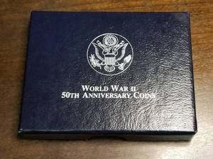 lot 29-A image: 1991-1995 US WWII COMMEMORATIVE SILVER DOLLAR IN ORIGINAL PACKAGING