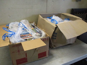 lot 72 image: Boxes of Stuffed Animals and Movies