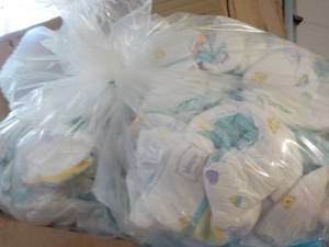 lot 374 image: 100 or so diapers and a box of cere...