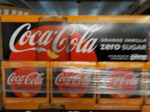 lot 415 image: 3 12 packs Coca-Cola Orange Vanilla...