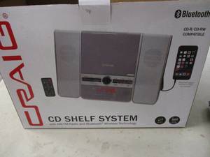 lot 32 image: Craig CD shelf system with radio an...