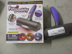 lot 123 image: 2 Fur Daddy sonic pet hair removers...