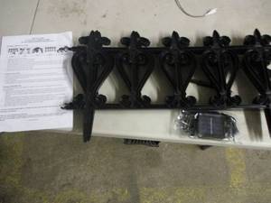 lot 199 image: black garden fenceborder with sola...