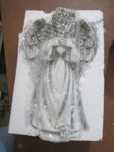 lot 214 image: Solar Powered Garden Angel open box...