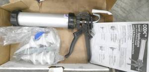 lot 103 image: Caulk gun or sausage stuffer take your pick