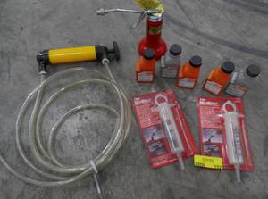 lot 152 image: Siphon pump, oil can, 2 cycle fuel mixing pumps and Stihl oil