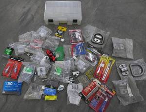 lot 162 image: Lot of new hardware, plugs, caps, D-rings, clamps and a deep Plano box to keep it in