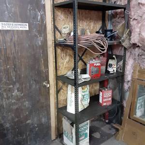 Tall metal storage shelf with misc ...