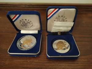 lot 50 image: Two Preserve Planet Earth Silver Plated Coins