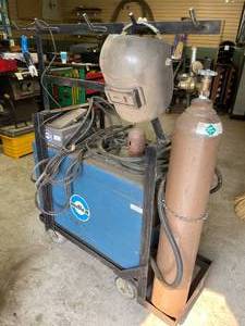 lot 296 image: Miler AC  DC Gas Tungsten  Arc or Shielded  Metal Arc Welding Machine With Tank