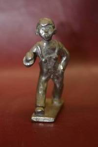 lot 44 image: heavy small metal statue boy in overalls
