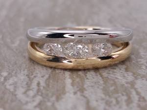 lot 10 image: Gorgeous .75 Carat Channel Set Diamond Ring in Two-Toned 14k Gold