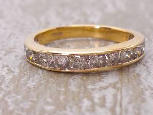 lot 30 image: 1.25 Carat Channel Set Diamond Gold Ring