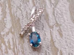 lot 31 image: Ocean Blue Natural Sapphire and Diamond Ribbon Style Pendant in 14k Gold