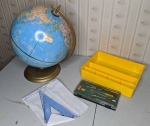 lot 71 image: Mixed Lot of School Supplies - Vintage Helix Drawing Set, Globe w Stand, Yellow Storage Tray, & Set of (2) Triangle Rulers