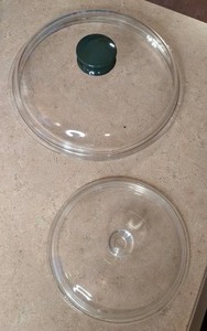 lot 63 image: (2) Glass Lids see pictures