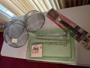 lot 43 image: (3) Mesh Food Covers, Green Serving Tray, Smart Cooking 4 in 1 Stainless Steel Spatula, (2) Sets of Skewers, Vintage Smurf Napkins