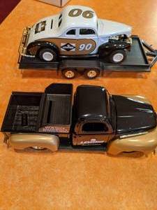 lot 29 image: (2) Ertl Collectible Cars with Leviton Logo