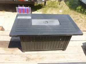 Model GAD17102l fire pit. 48 x 28 x 24. Looks new. Is missing doors. As shown.