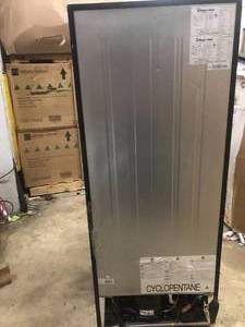 lot 44 image: Top Freezer Refrigerator in Black by Magic Chef