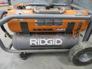 lot 47 image: RIDGID GAS HANDTRUCK AIR COMPRESSOR.