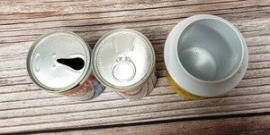 lot 27 image: Old Schmidt Pull Tab Beer Cans and a Old Can Cooler