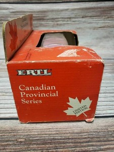 lot 32 image: Die Cast Canadian Limited Edition Coin Bank Car