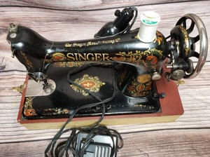 lot 140 image: Antique Red Eye Singer Sewing Machine
