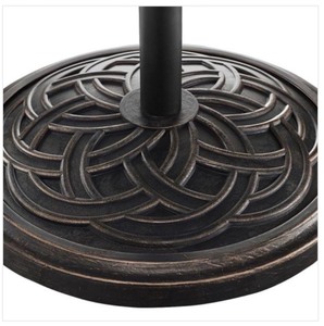 lot 52 image: Circle Weave Round Metal Patio Umbrella Base in Antique Bronze by Walker Edison Furniture Company ITS RETAIL PRICE is $71.99