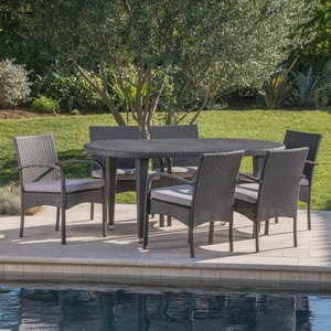 lot 23 image: Kyle Grey 7-Piece Wicker Outdoor Dining Set with Grey Cushion by Noble House, Its RETAIL PRICE is $699.99