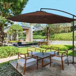 lot 30 image: 11 ft. Market Umbrella Cantilever Tilt Patio Umbrella in Brown with Crank and Cross Base The retail price $189.99