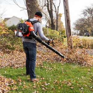 lot 45 image: 216 MPH 517 CFM 58.2cc Gas 2-Stroke Cycle Backpack Leaf Blower with Tube Throttle The retail price $349.00