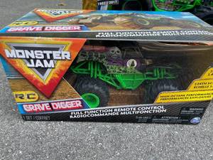 lot 25 image: 3 Grave Diggers Remote Control Cars (NEW)