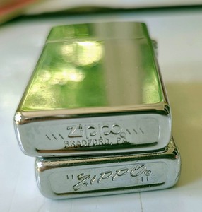 lot 255 image: Vintage Lighters including Zippo