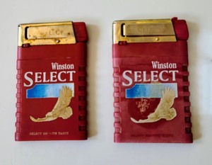 lot 254 image: Vintage Cigarette Advertising Lighters