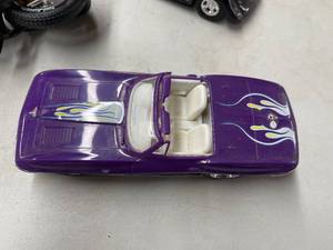 lot 539 image: 2 Plastic Toy Cars and a Motorcycle