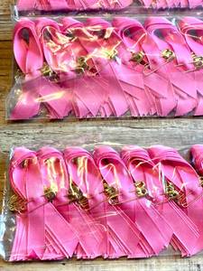 lot 115 image: Lot of 500 Pink Cancer Ribbons with Gold Safety Pins